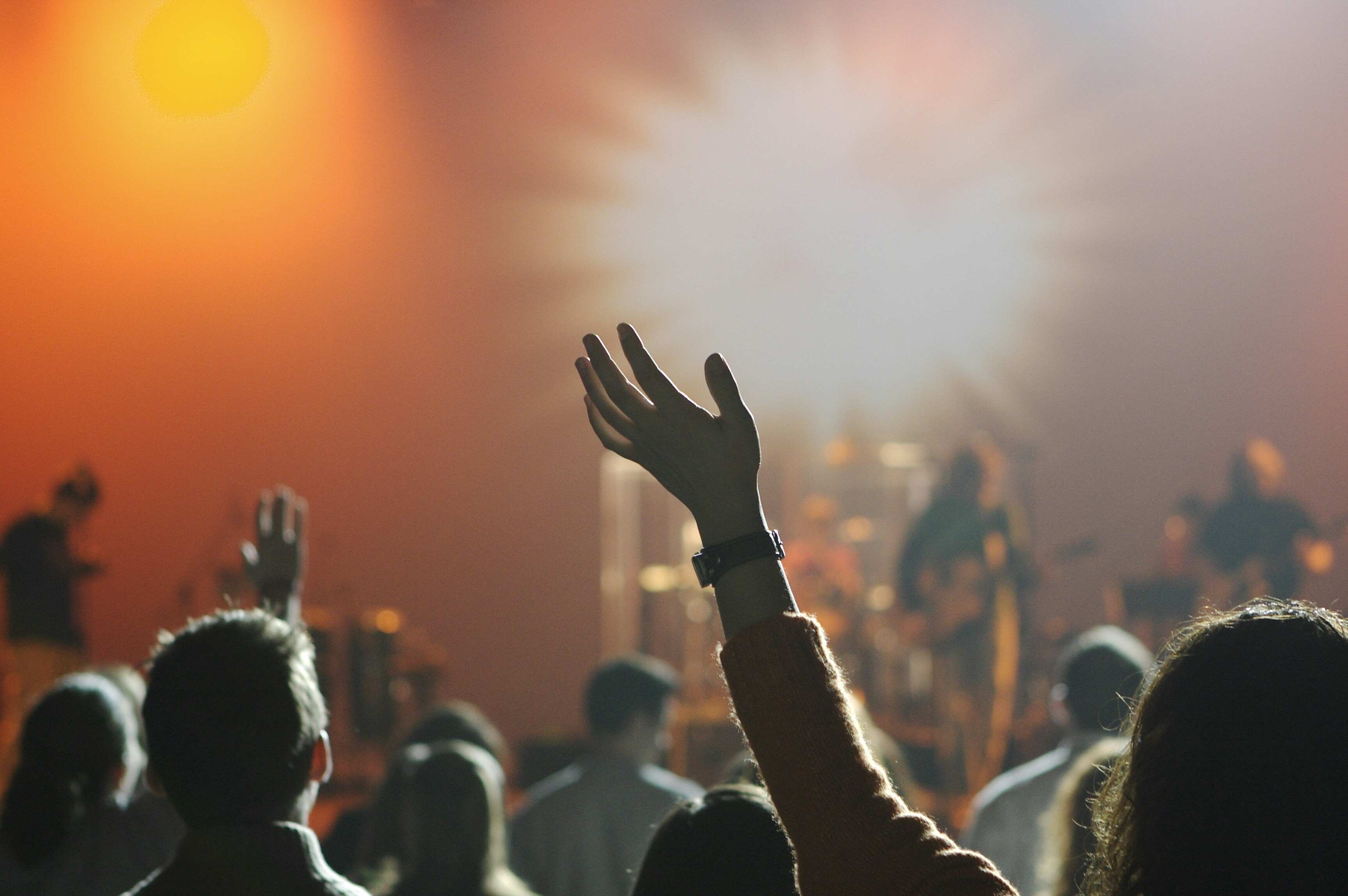 Congregation raising hands in worship